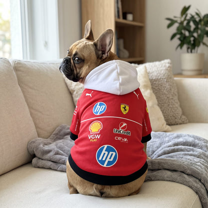 French bulldog wearing Ferrari 2025 pet hoodie back view with HP Shell and Ferrari team logos on couch